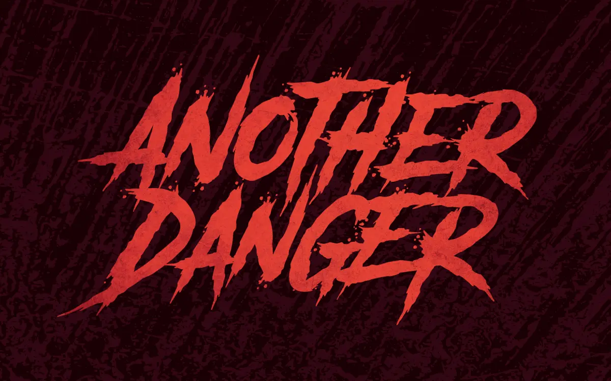 Another Danger: a distressed horror caps face for splatter-style branding